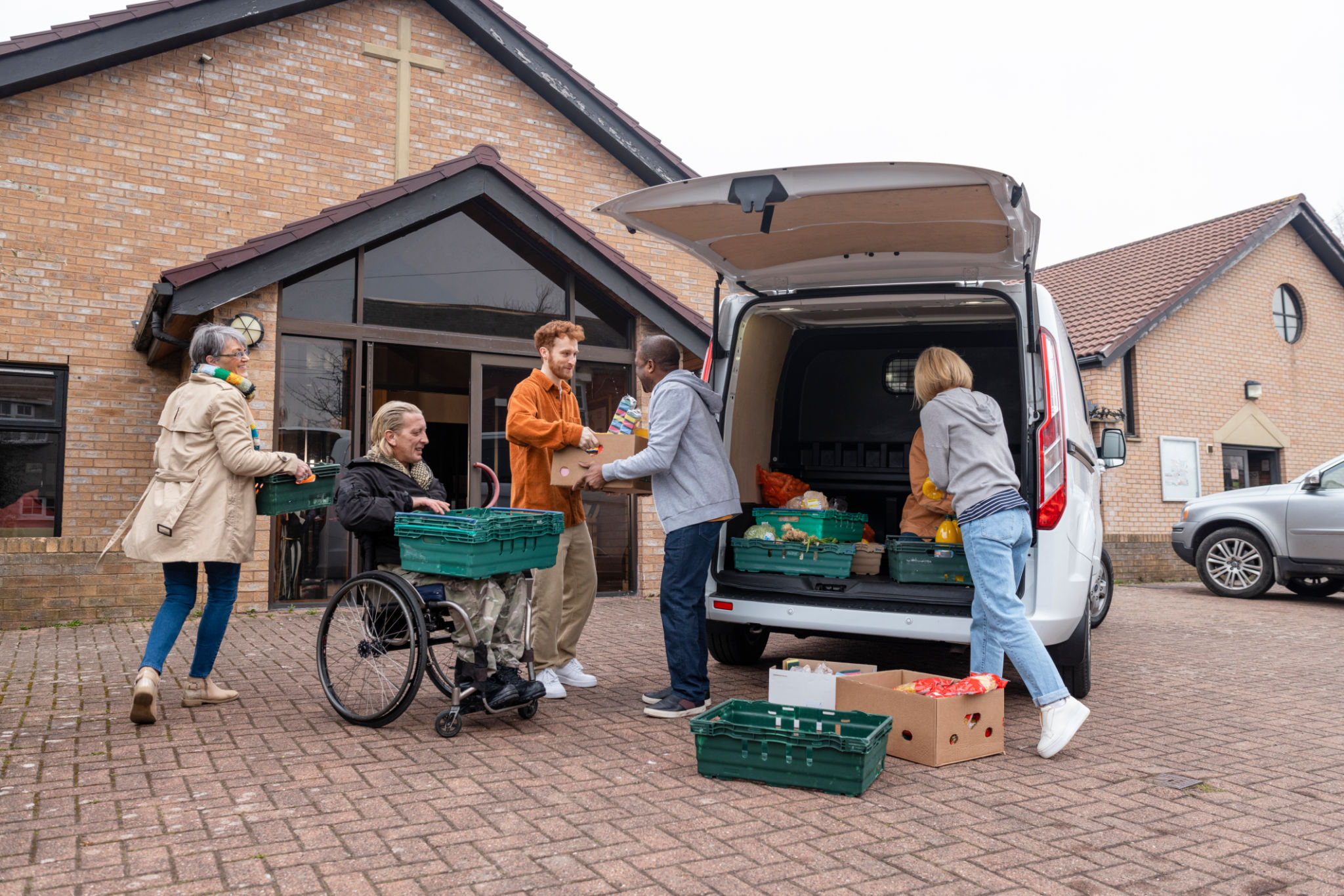 Volunteers unloading food donations for a community program