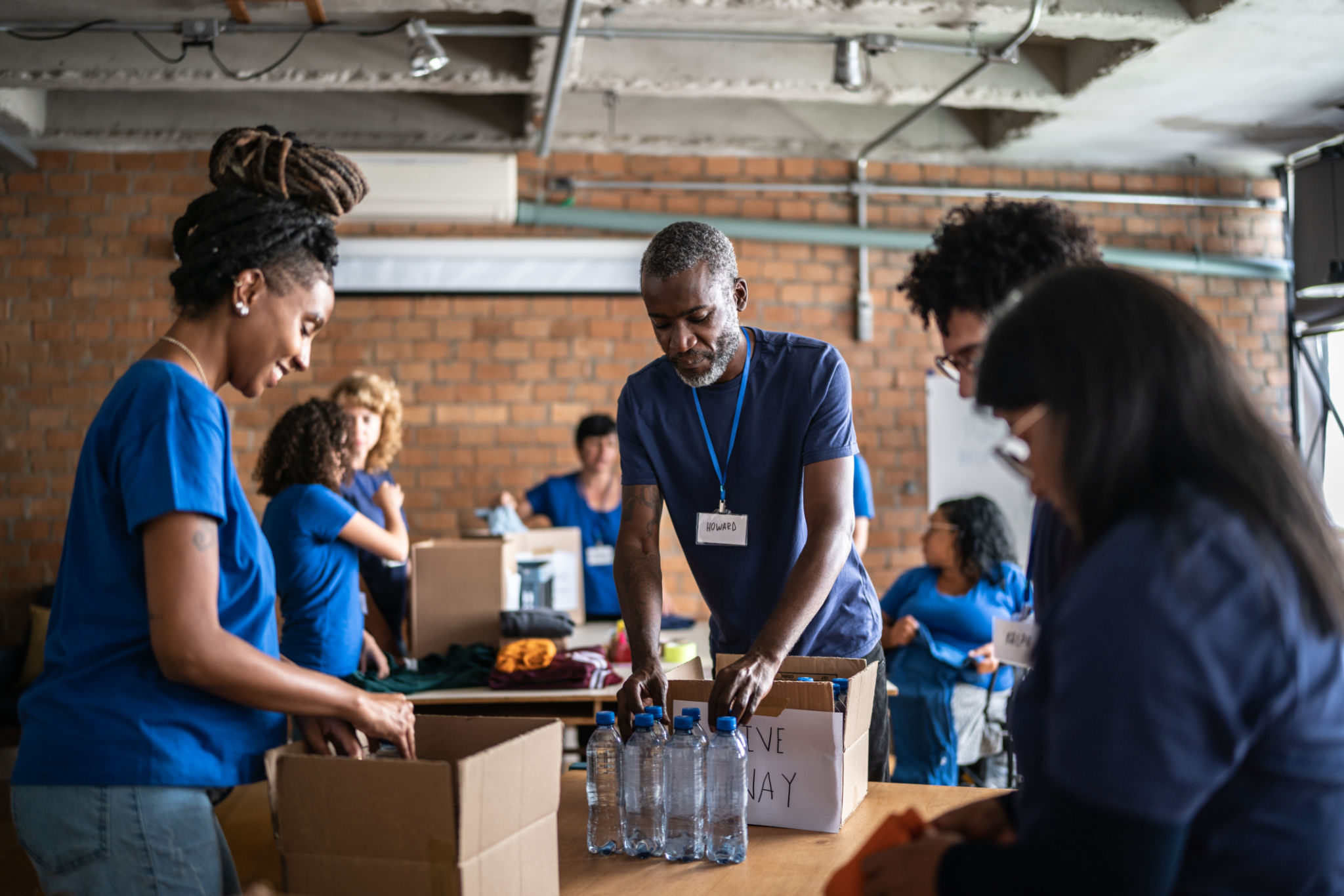 Volunteers organizing donations at a community support center